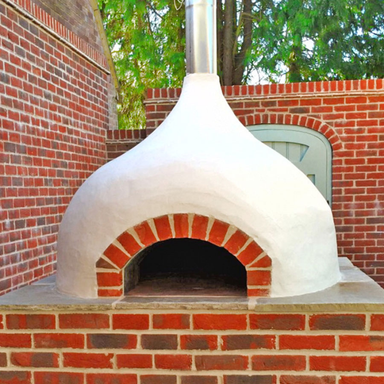 Lifestyle shot Igneus Ceramiko Pro 1000 Wood Fired Pizza Oven
