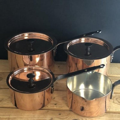 Front view of collection Netherton Foundry Copper Pan Set : Milk Pan and 6, 7, 8 inch Spun Saucepans with Lids