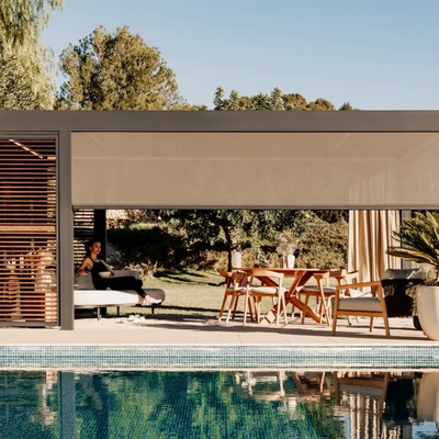 Renson pergola with louvered roof next to pool