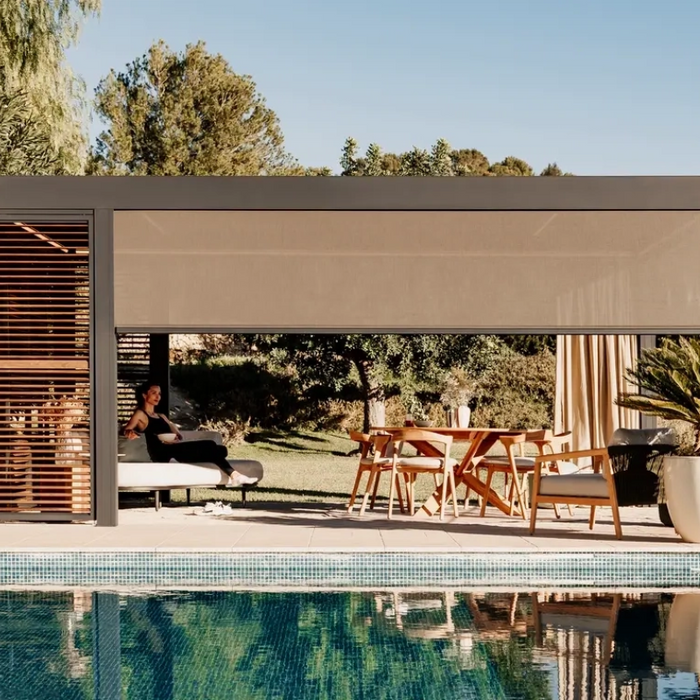 Renson pergola with louvered roof next to pool