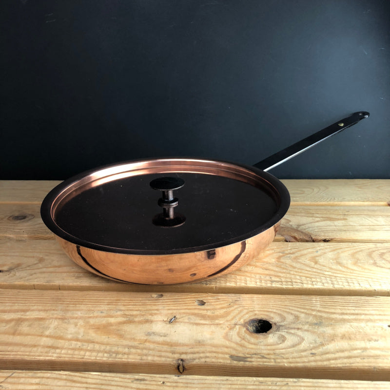 Front view of copper chefs pan