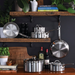 Close up lifestyle shot of Hestan ProBond Induction Stainless Steel Pan Set: 10 Piece hanging in kitchen