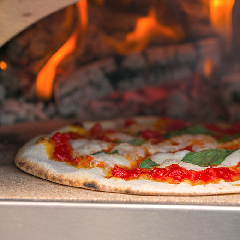 Lifestyle shot of Igneus Minimo pizza cooked