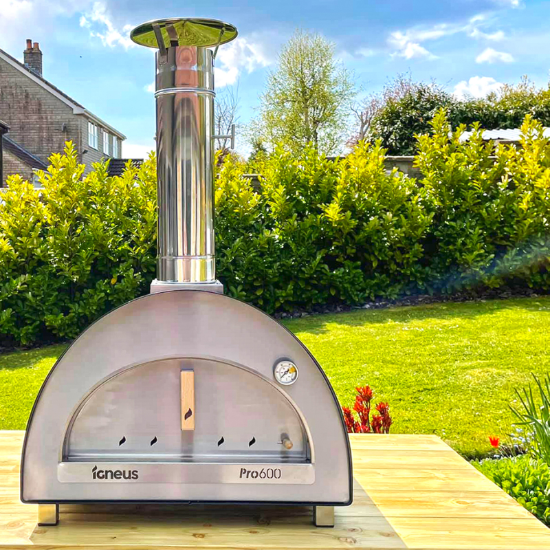 Front view of Igneus Pro 600 with door closed lifestyle shot in garden