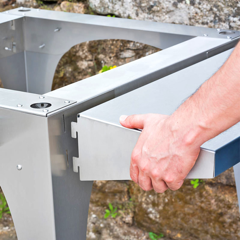 Lifestyle shot of assembling Igneus Classico shelf stand