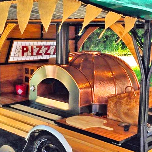 Lifestyle shot of Igneus Ceramiko 760 wood fired pizza oven