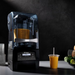 Lifestyle shot on black background of  Vitamix The Quiet One On Counter Blender
