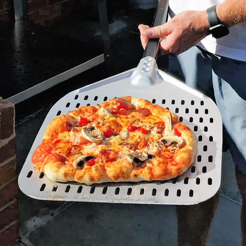 Lifestyle shot of Igneus Pro 12 pizza peel